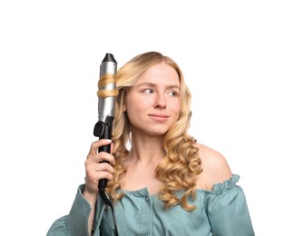 Photo of Woman curling her hair on white background