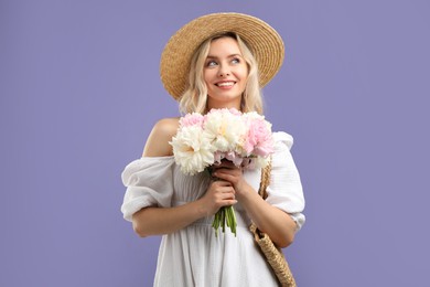 Photo of Happy woman with bouquet of beautiful peonies on purple background