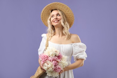 Photo of Happy woman with bouquet of beautiful peonies on purple background