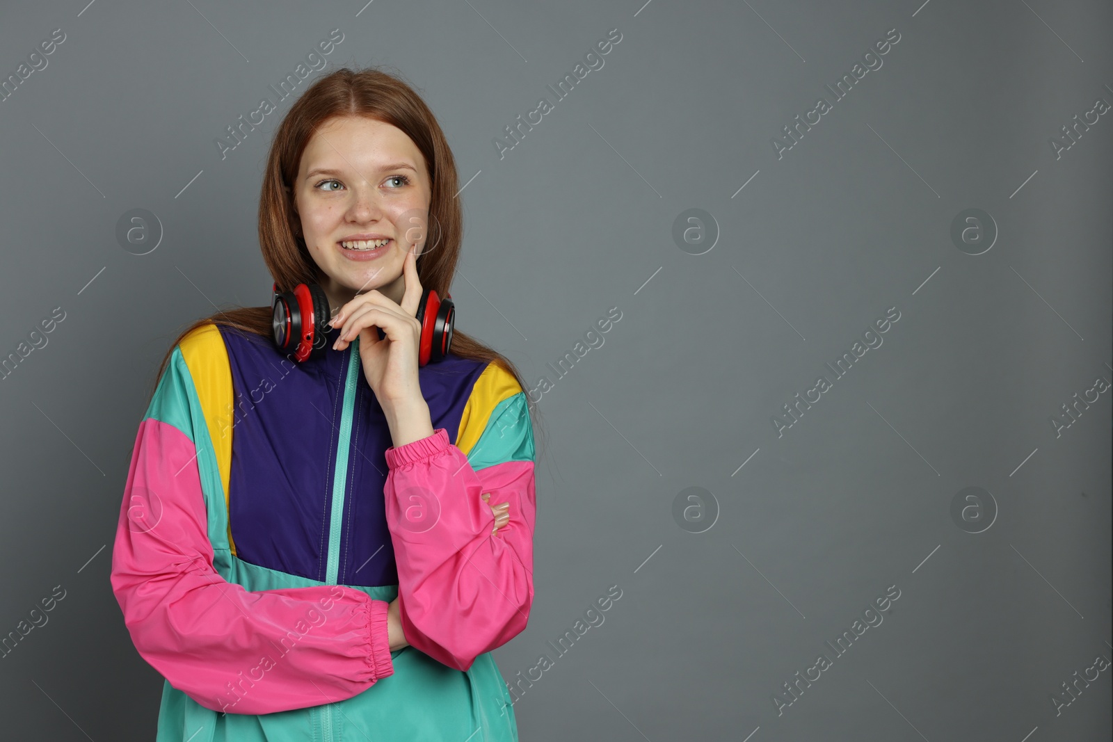 Portrait of teenage girl on grey background. Space for text Photo of Portrait of teenage girl on grey background. Space for text
