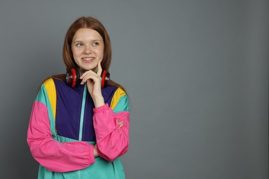 Photo of Portrait of teenage girl on grey background. Space for text