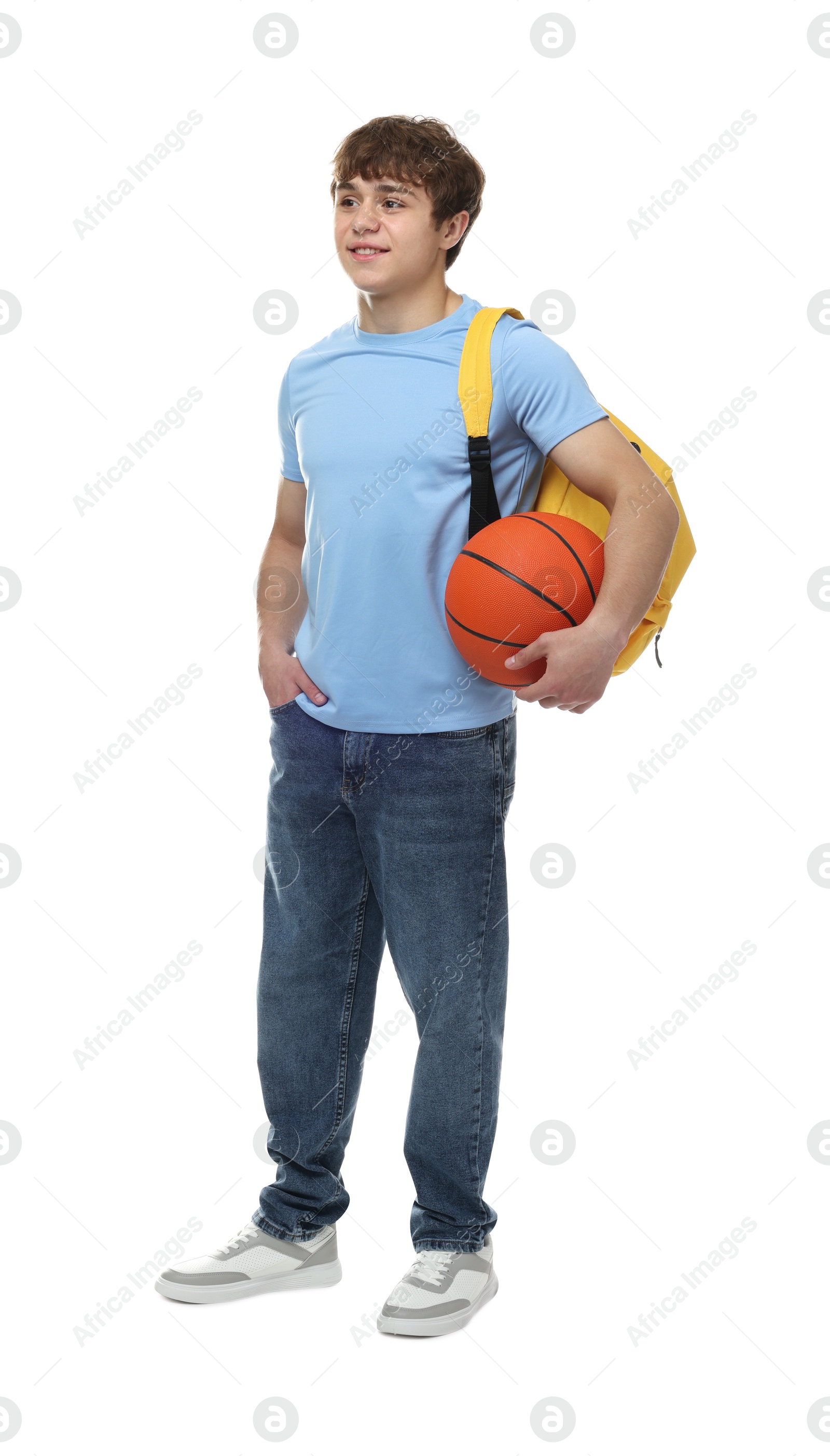 Teenage boy with basketball on white background Photo of Teenage boy with basketball on white background
