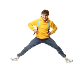 Photo of Happy teenage boy jumping on white background