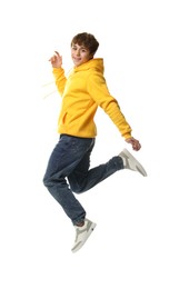 Photo of Happy teenage boy jumping on white background
