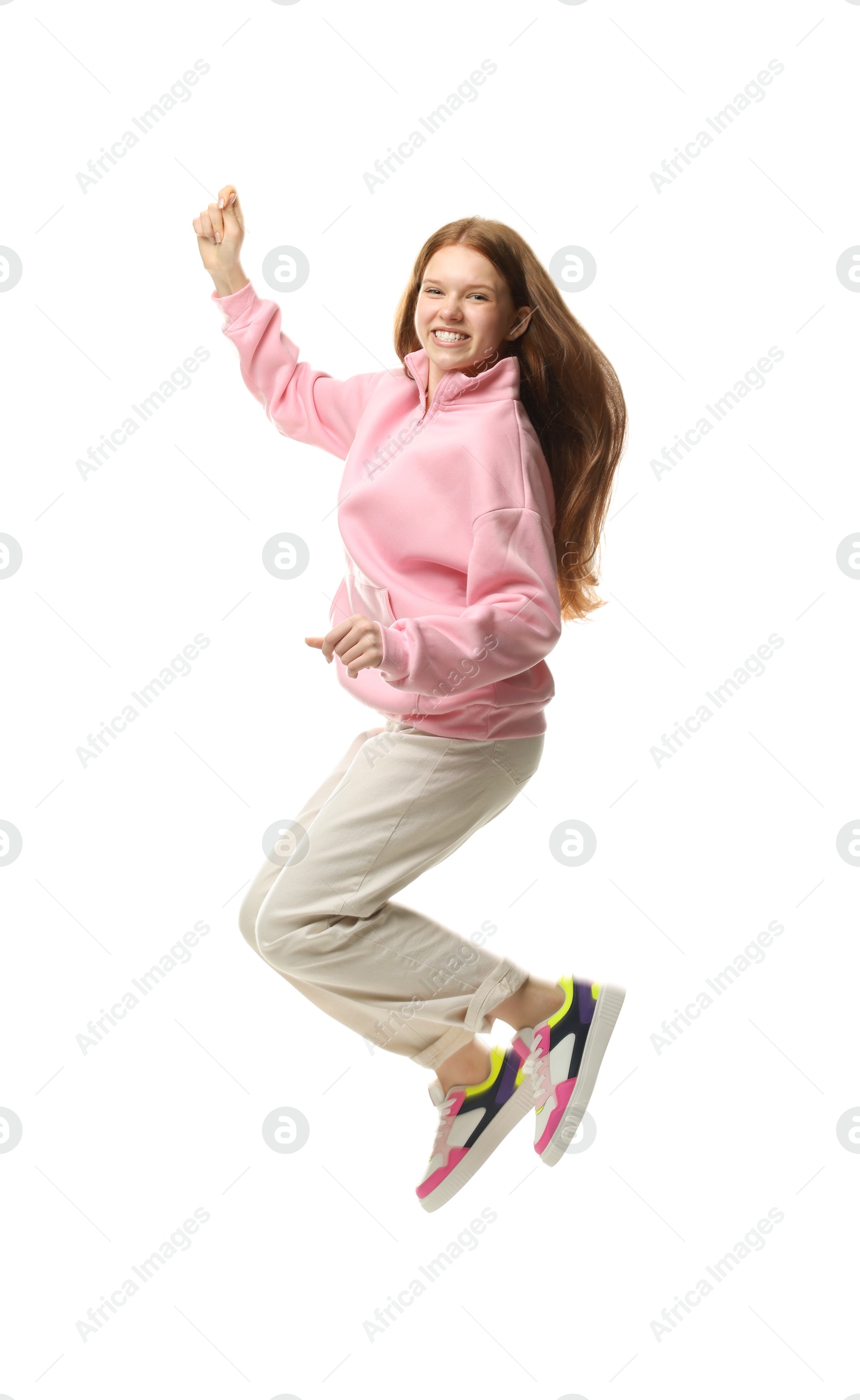 Happy teenage girl jumping on white background Photo of Happy teenage girl jumping on white background