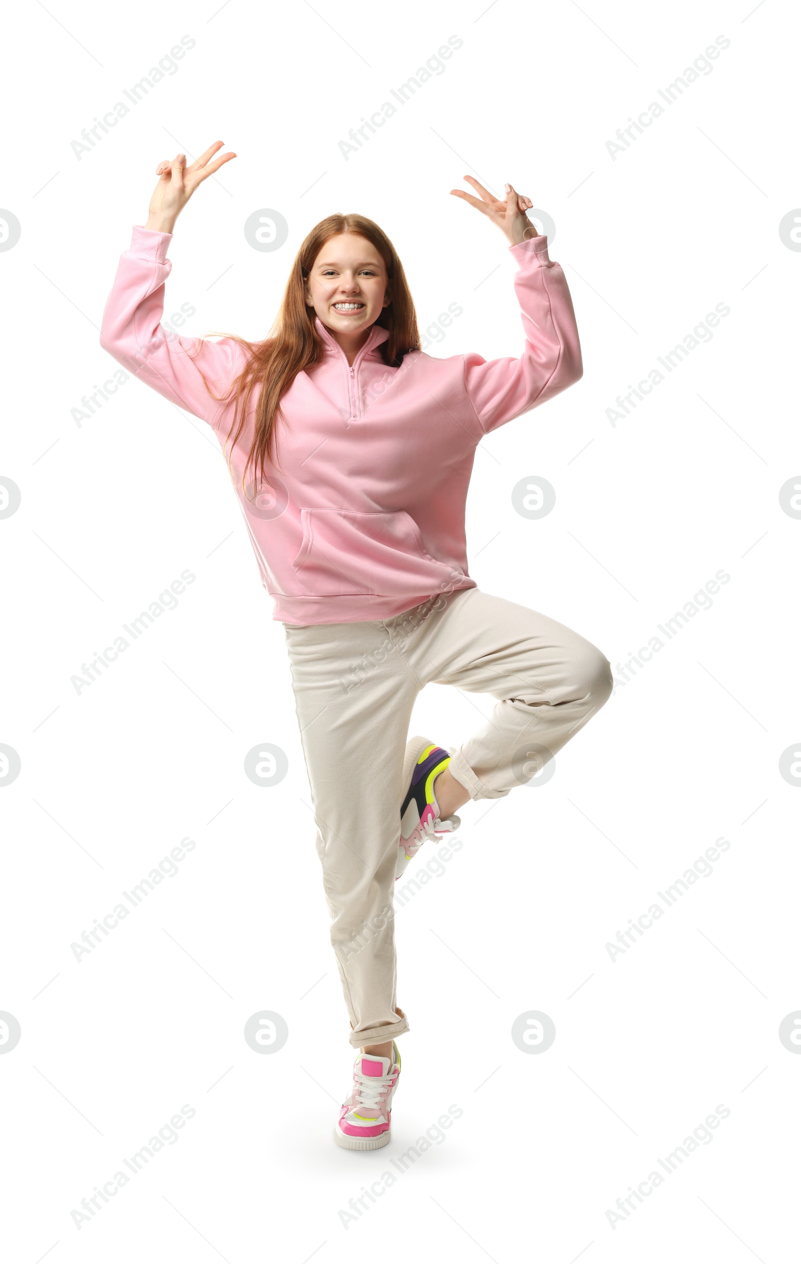 Happy teenage girl posing on white background Photo of Happy teenage girl posing on white background