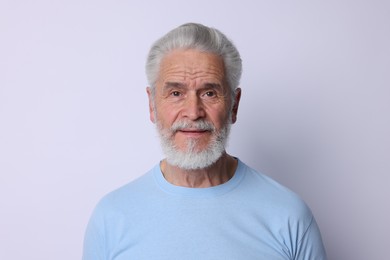 Photo of Portrait of positive senior man on light background