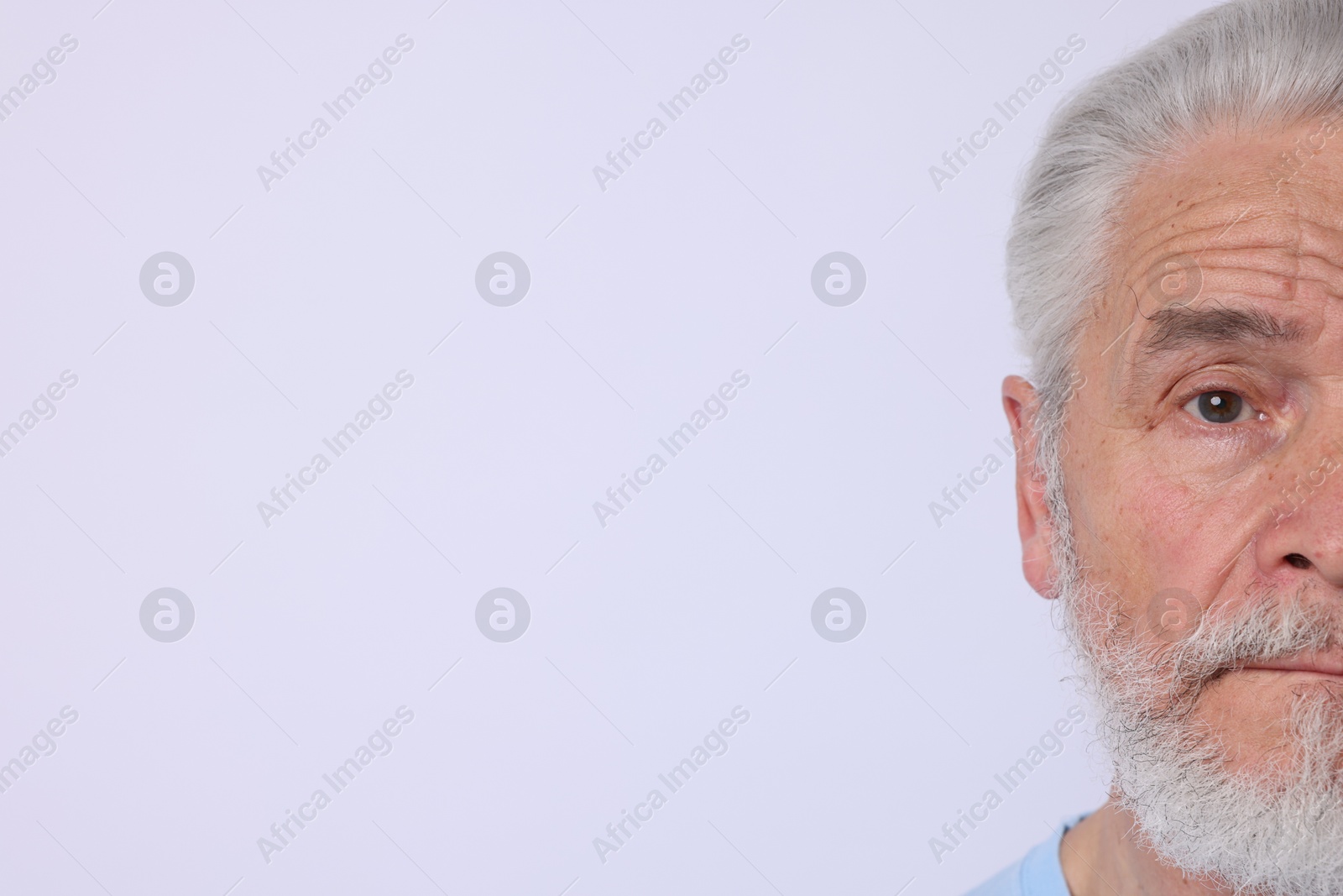 Senior man on light background. Space for text Photo of Senior man on light background. Space for text