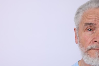 Photo of Senior man on light background. Space for text