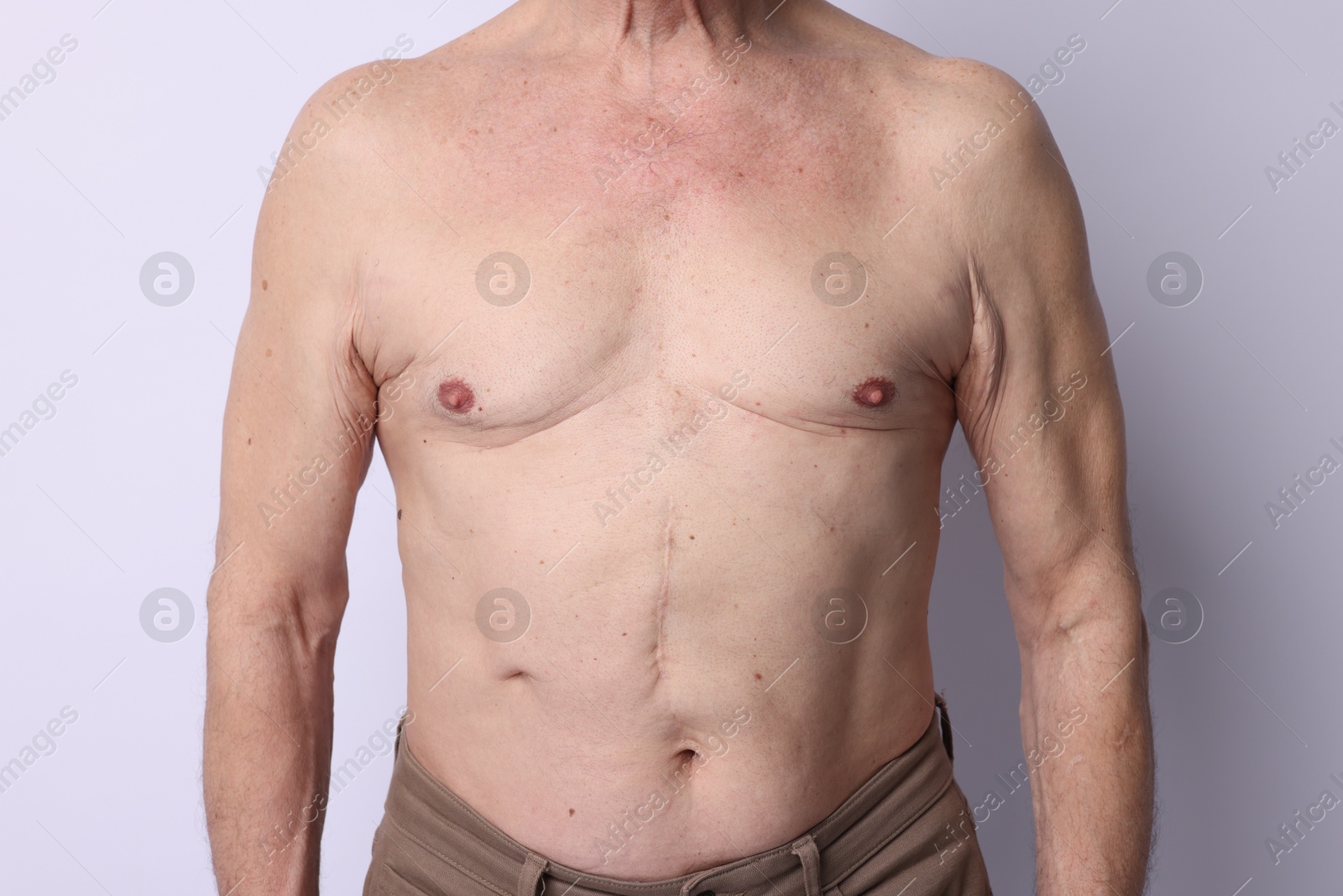 Shirtless senior man on light background, closeup Photo of Shirtless senior man on light background, closeup
