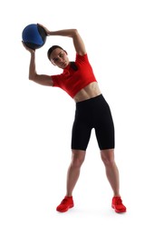 Photo of Athletic woman exercising with medicine ball on white background