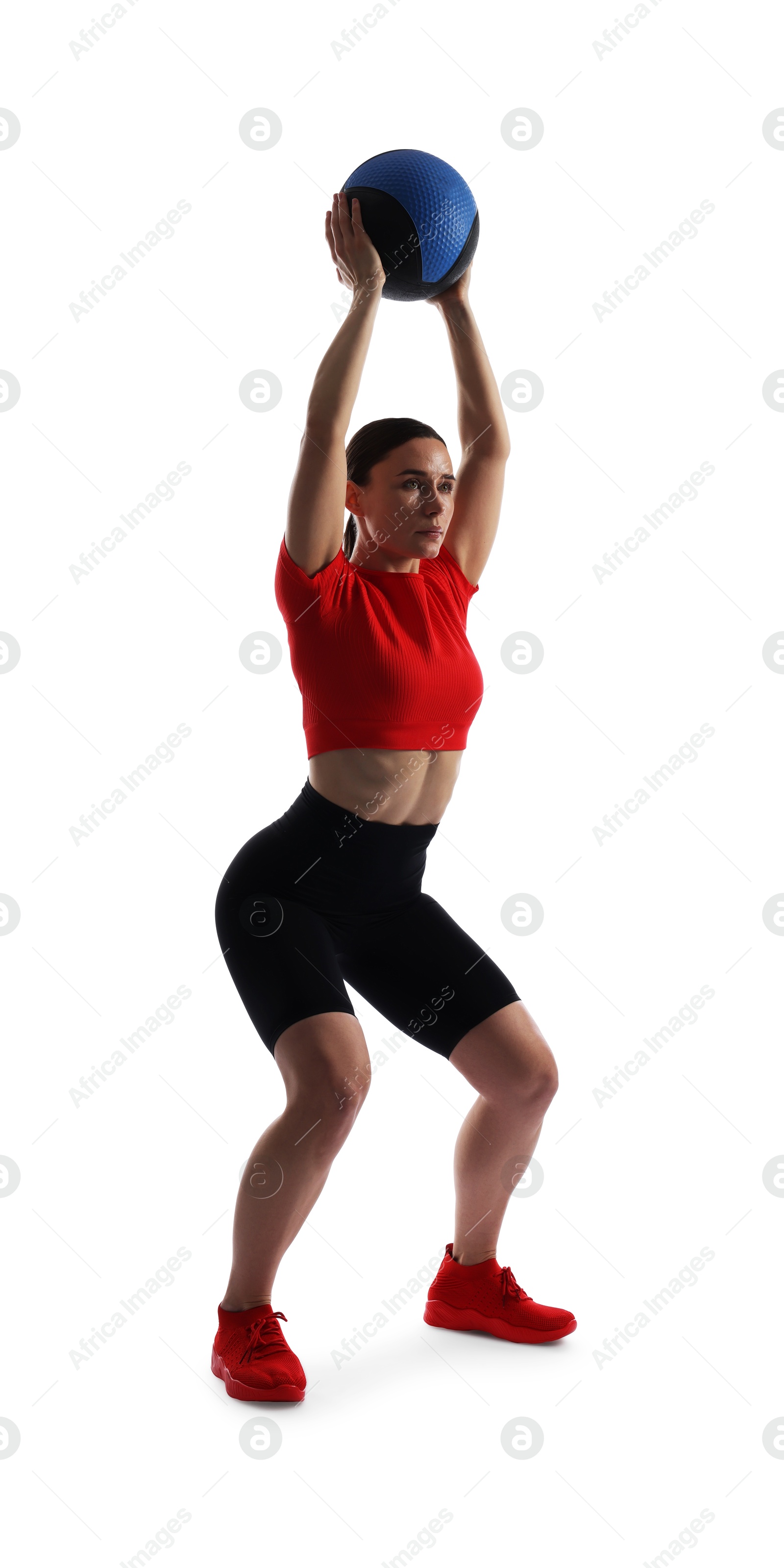 Athletic woman exercising with medicine ball on white background Photo of Athletic woman exercising with medicine ball on white background