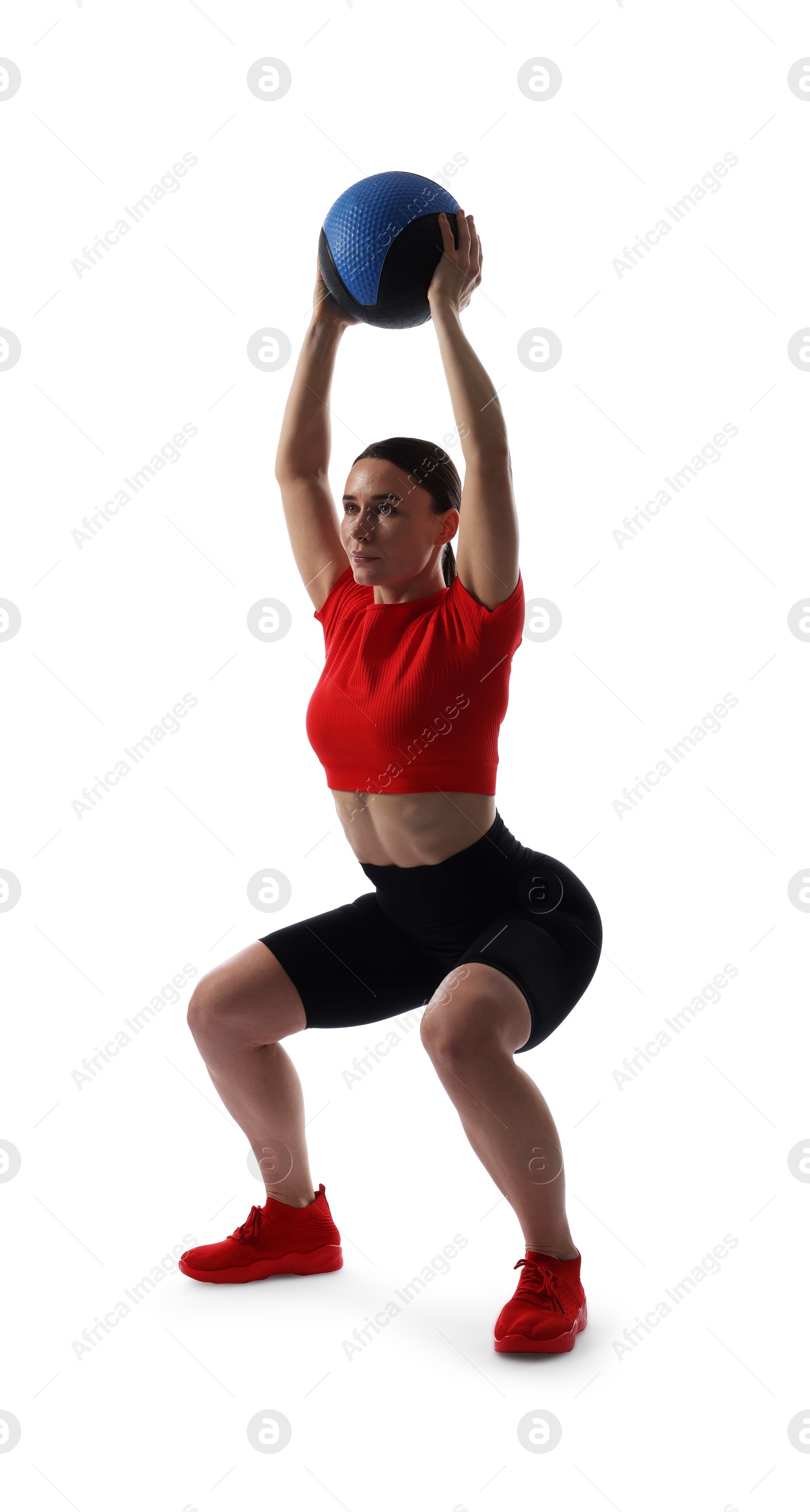 Athletic woman exercising with medicine ball on white background Photo of Athletic woman exercising with medicine ball on white background