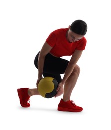 Photo of Athletic woman exercising with medicine ball on white background