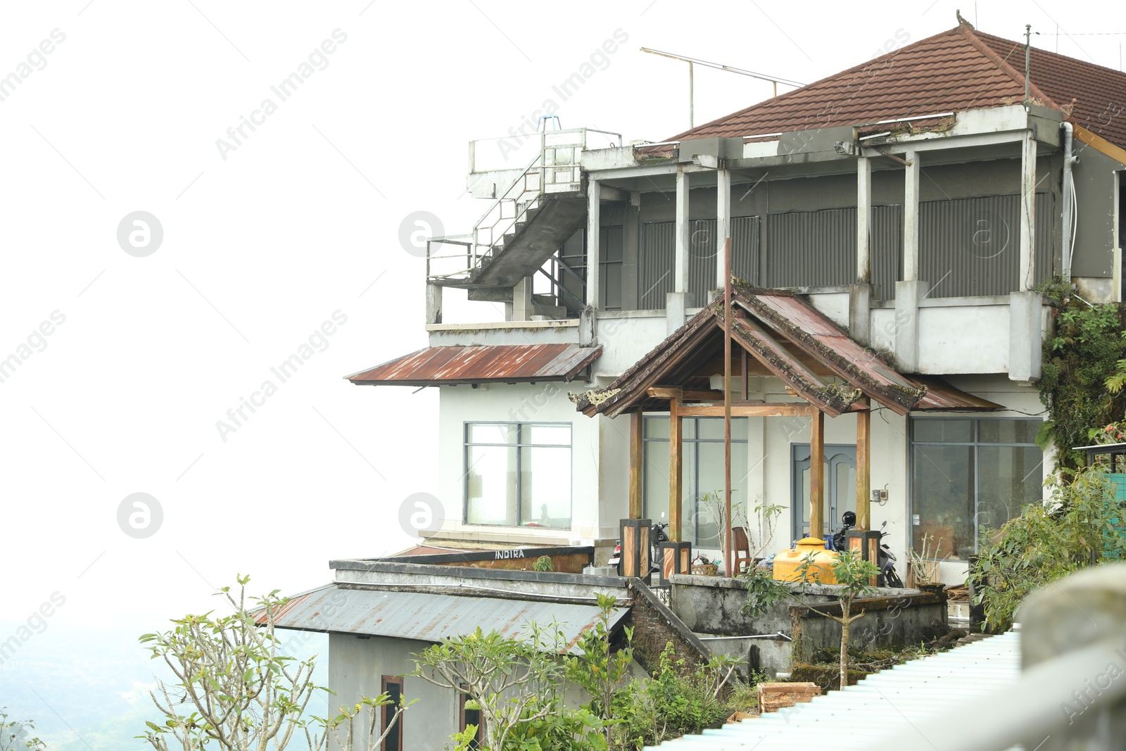 Bali, Indonesia - May 18, 2025: House with balcony and different plants Photo of Bali, Indonesia - May 18, 2025: House with balcony and different plants