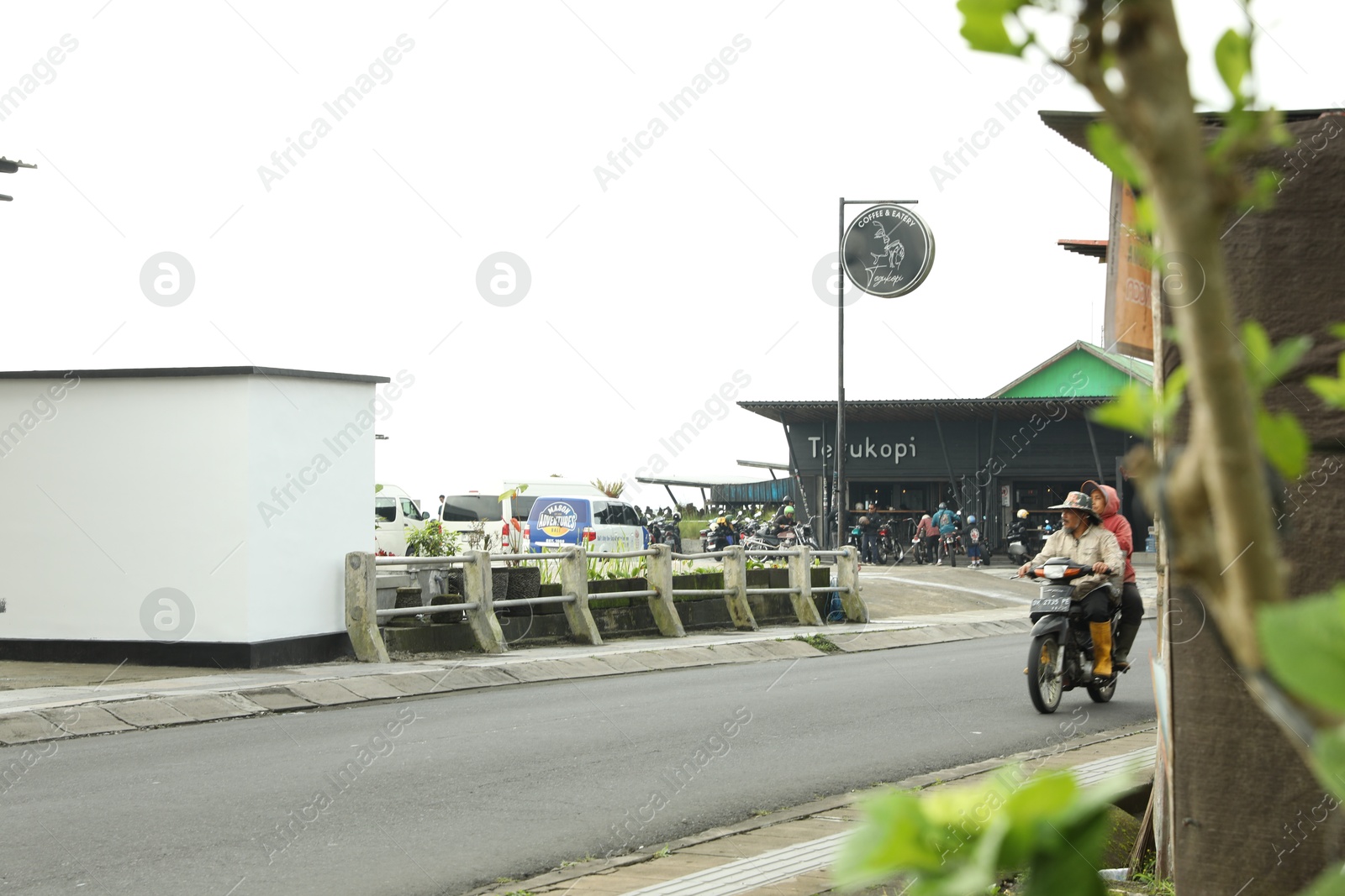 Bali, Indonesia - May 18, 2025: Many bikers near coffee shop in city Photo of Bali, Indonesia - May 18, 2025: Many bikers near coffee shop in city