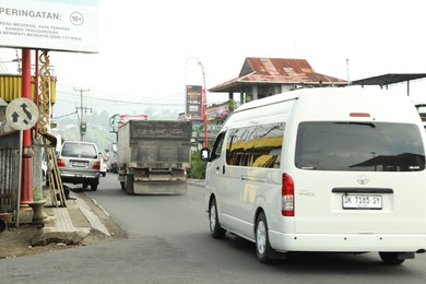 Photo of Bali, Indonesia - May 18, 2025: Many cars on road in city