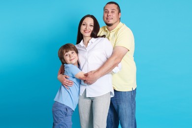 Photo of Portrait of happy family on light blue background