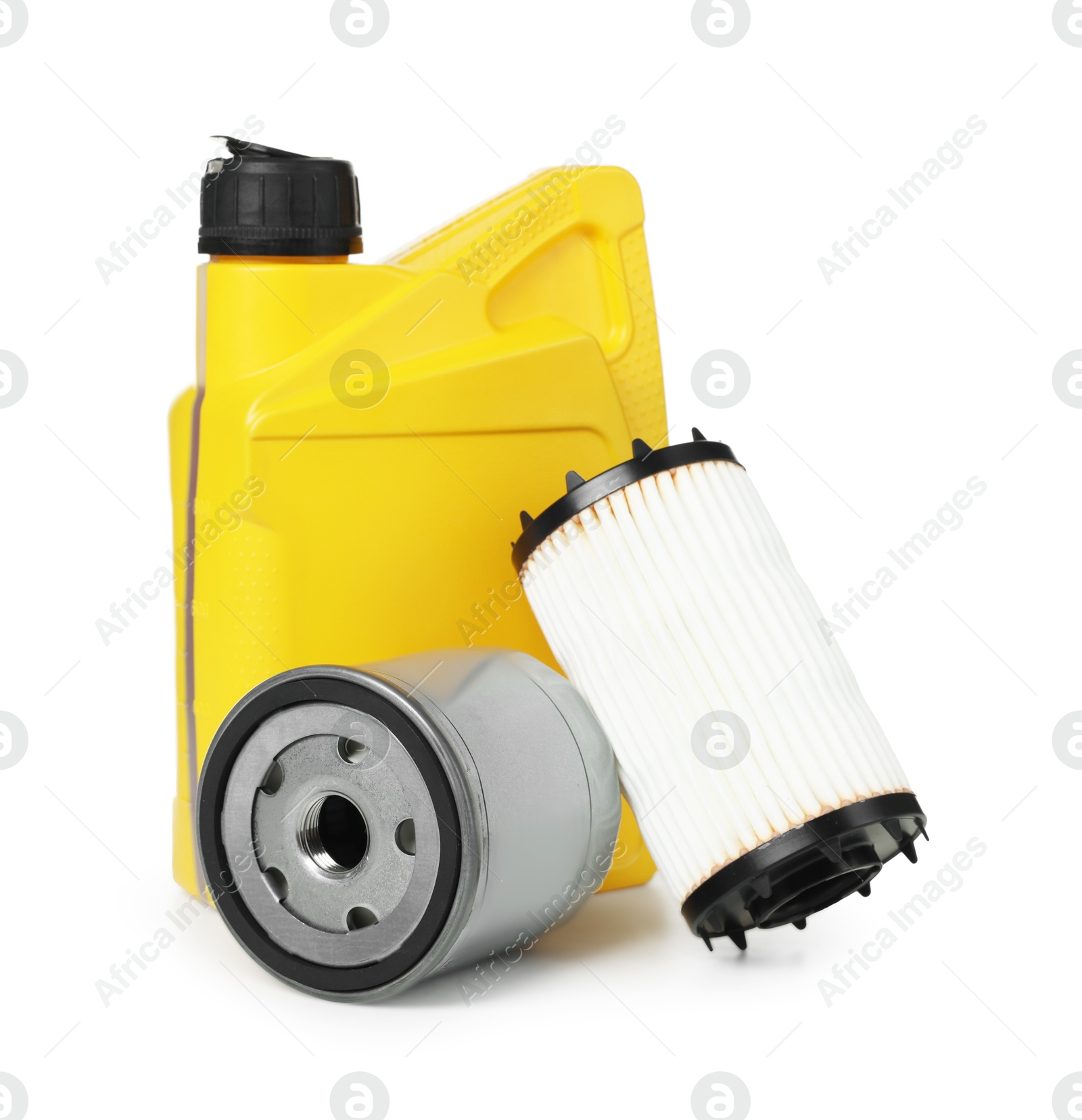Motor oil in yellow canister and filters isolated on white Photo of Motor oil in yellow canister and filters isolated on white
