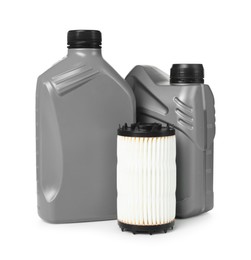 Photo of Motor oil in plastic canisters and filter isolated on white