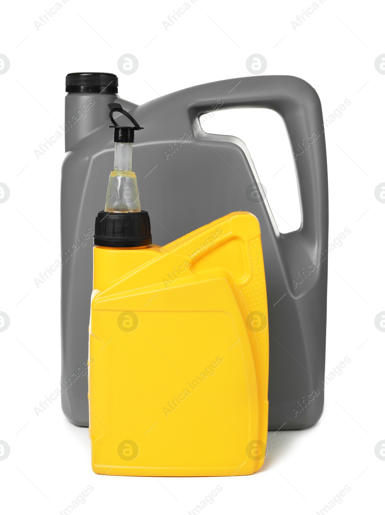 Motor oil in plastic canisters isolated on white Photo of Motor oil in plastic canisters isolated on white
