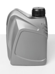 Photo of Motor oil in plastic canister isolated on white