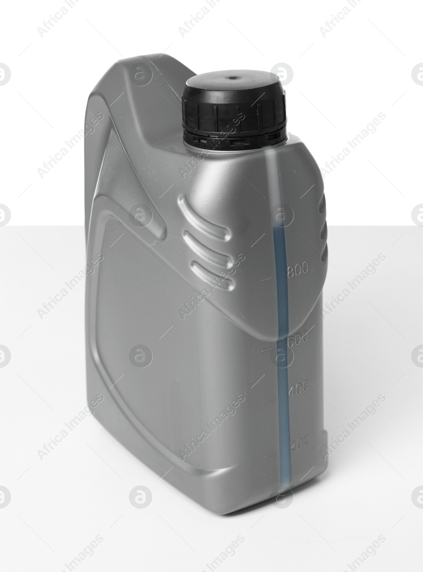 Motor oil in plastic canister isolated on white Photo of Motor oil in plastic canister isolated on white
