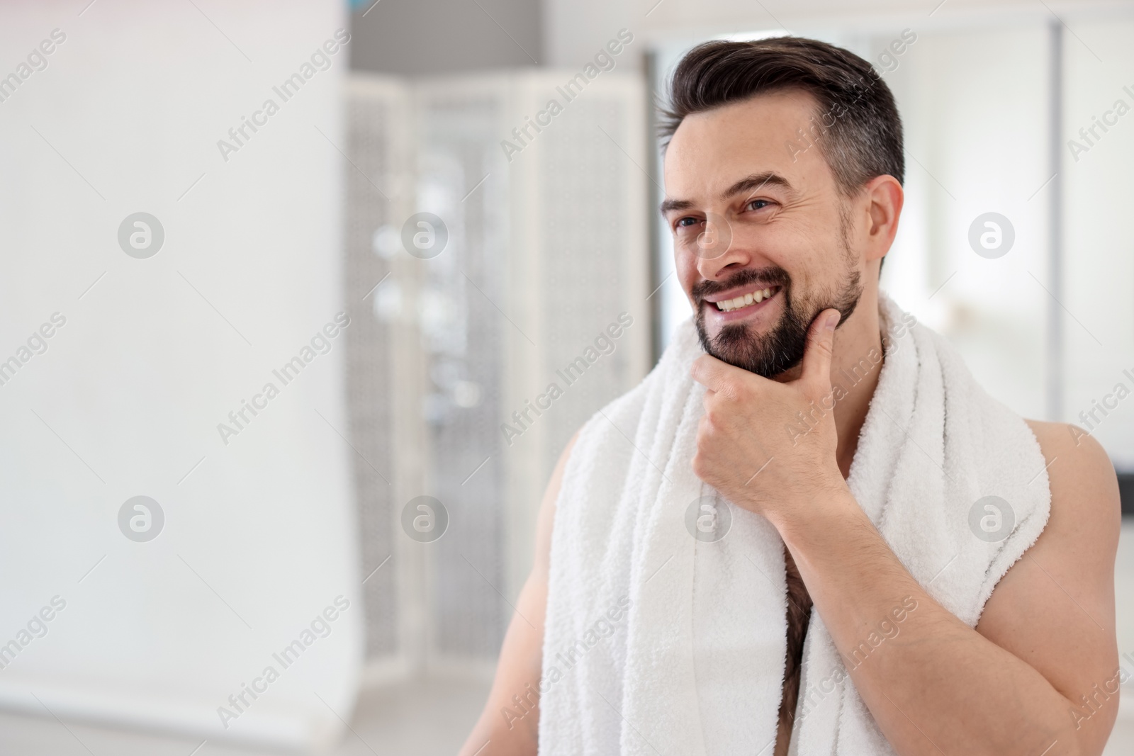Smiling man before shaving in bathroom. Space for text Photo of Smiling man before shaving in bathroom. Space for text