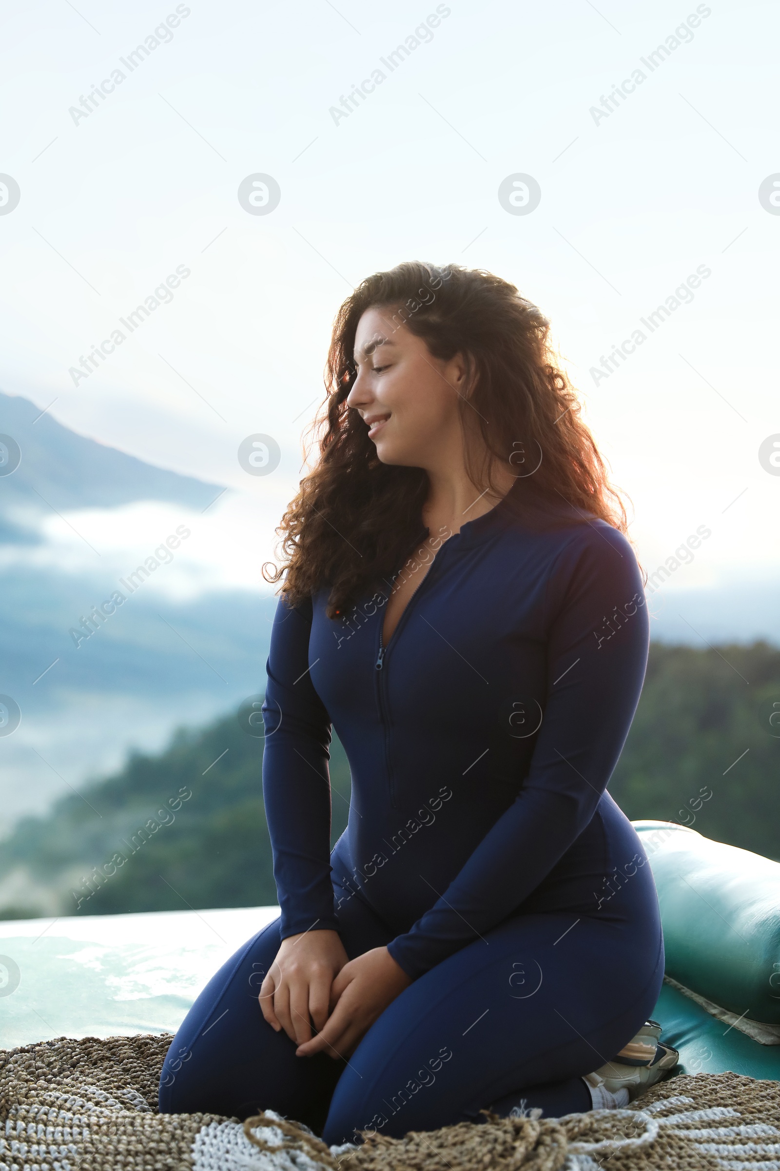 Beautiful woman enjoying picturesque view of mountains Photo of Beautiful woman enjoying picturesque view of mountains