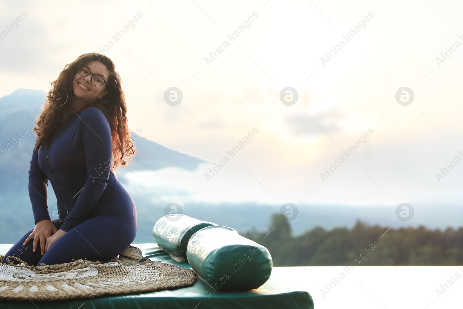 Beautiful woman enjoying picturesque view of mountains. Space for text Photo of Beautiful woman enjoying picturesque view of mountains. Space for text