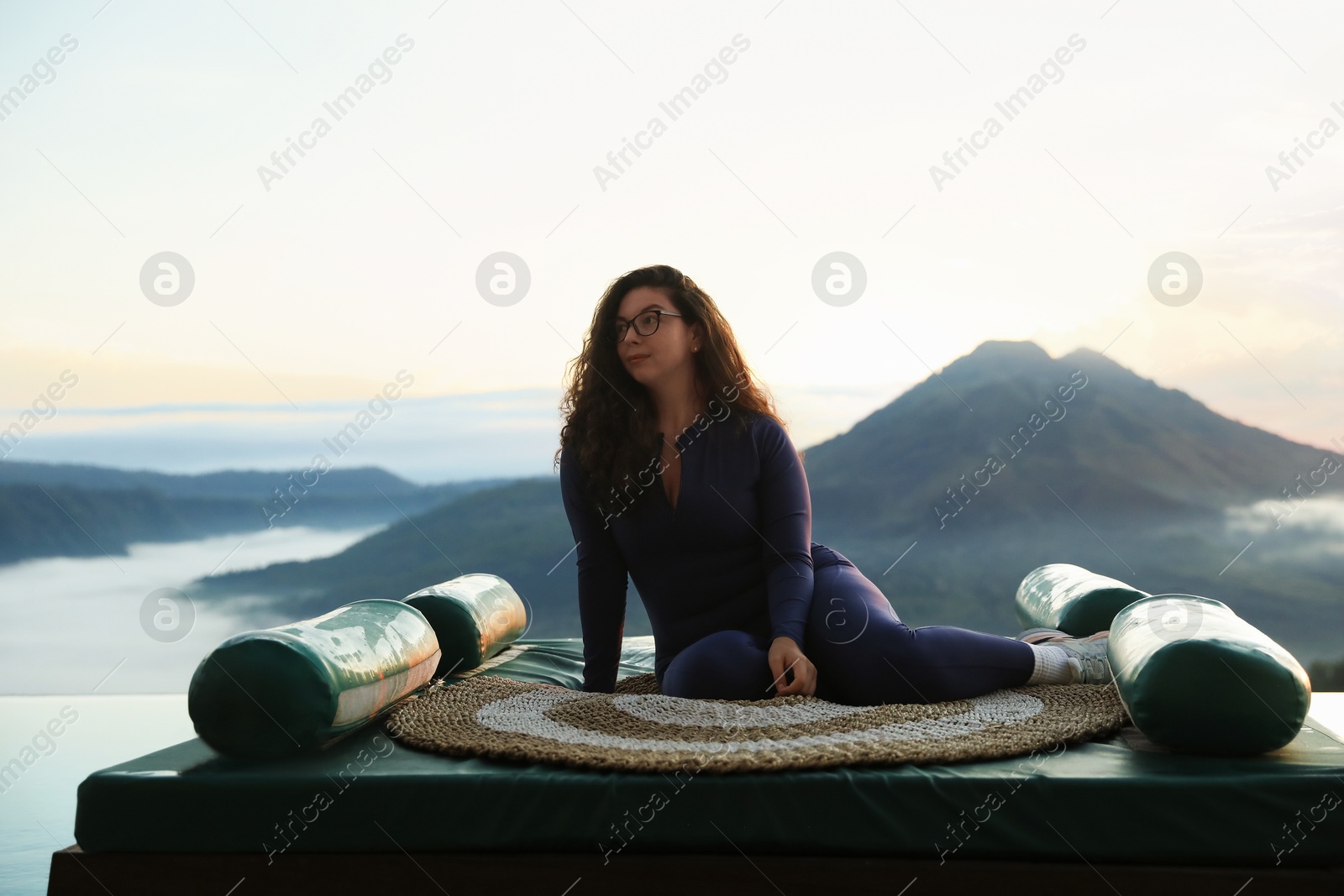 Beautiful woman enjoying picturesque view of mountains Photo of Beautiful woman enjoying picturesque view of mountains