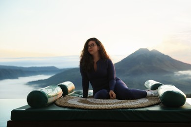 Photo of Beautiful woman enjoying picturesque view of mountains