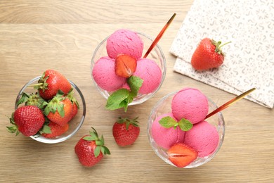 Photo of Refreshing sorbet, strawberries and mint on wooden table, flat lay