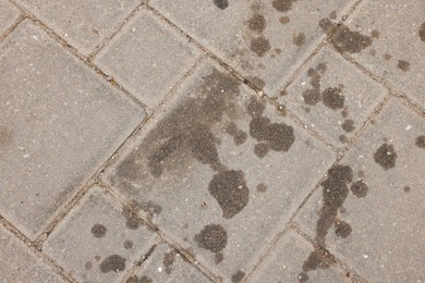 Photo of Stains of motor oil on road outdoors, top view