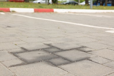 Photo of Stains of motor oil on road outdoors, closeup