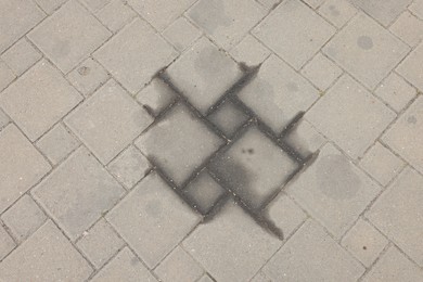 Photo of Stains of motor oil on road outdoors, top view