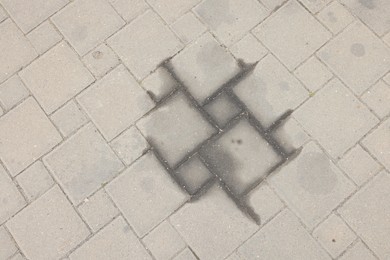 Photo of Stains of motor oil on road outdoors, top view