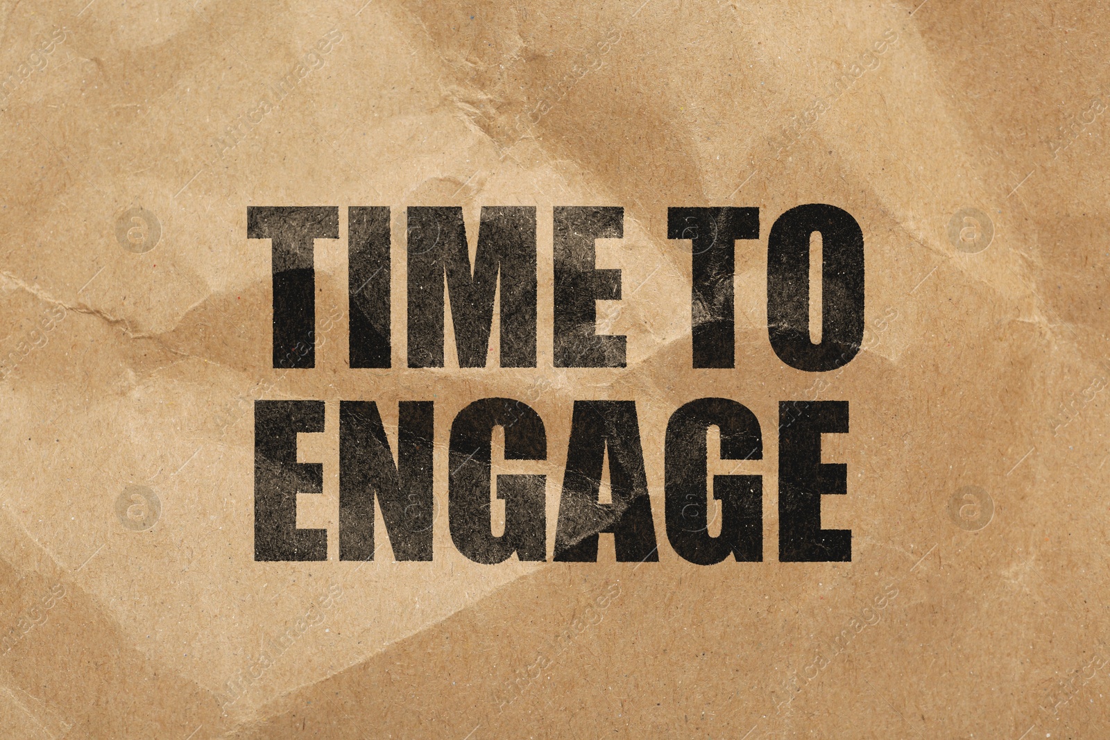 Time To Engage words on crumpled sheet of paper Image of Time To Engage words on crumpled sheet of paper