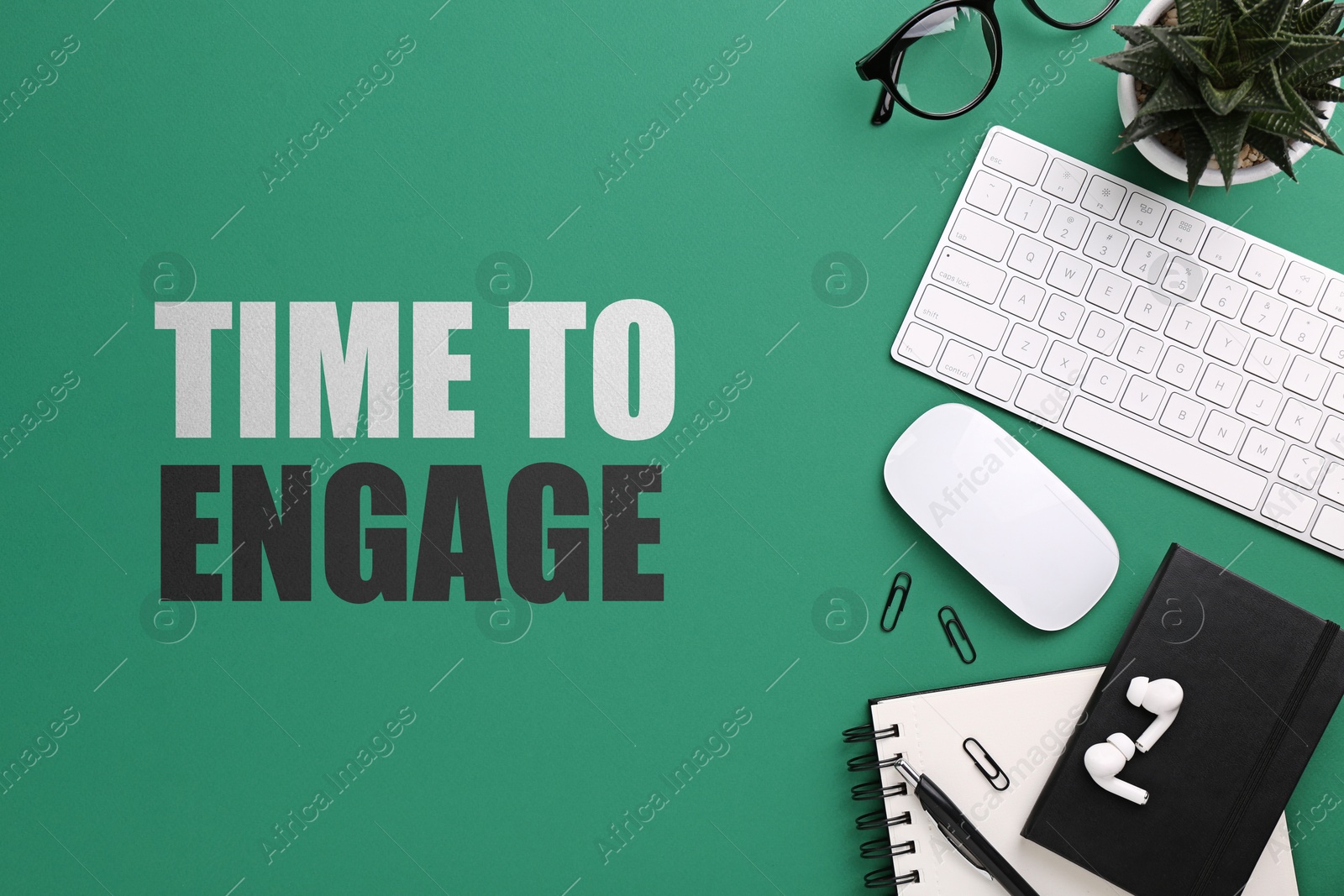 Image of Time to engage. Flat lay composition with stationery and computer keyboard on green background