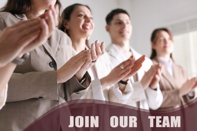 Image of Join Our Team. Group of people applauding indoors, low angle view. Employee search, recruitment concept