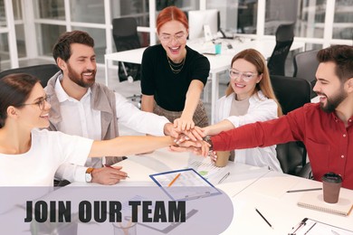 Image of Join Our Team. Group of people joining hands at table in office. Employee search, recruitment concept