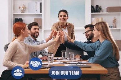 Image of Join Our Team. Group of people joining hands at table in office. Employee search, recruitment concept