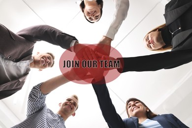 Image of Join Our Team. Group of people holding hands together indoors, bottom view. Employee search, recruitment concept