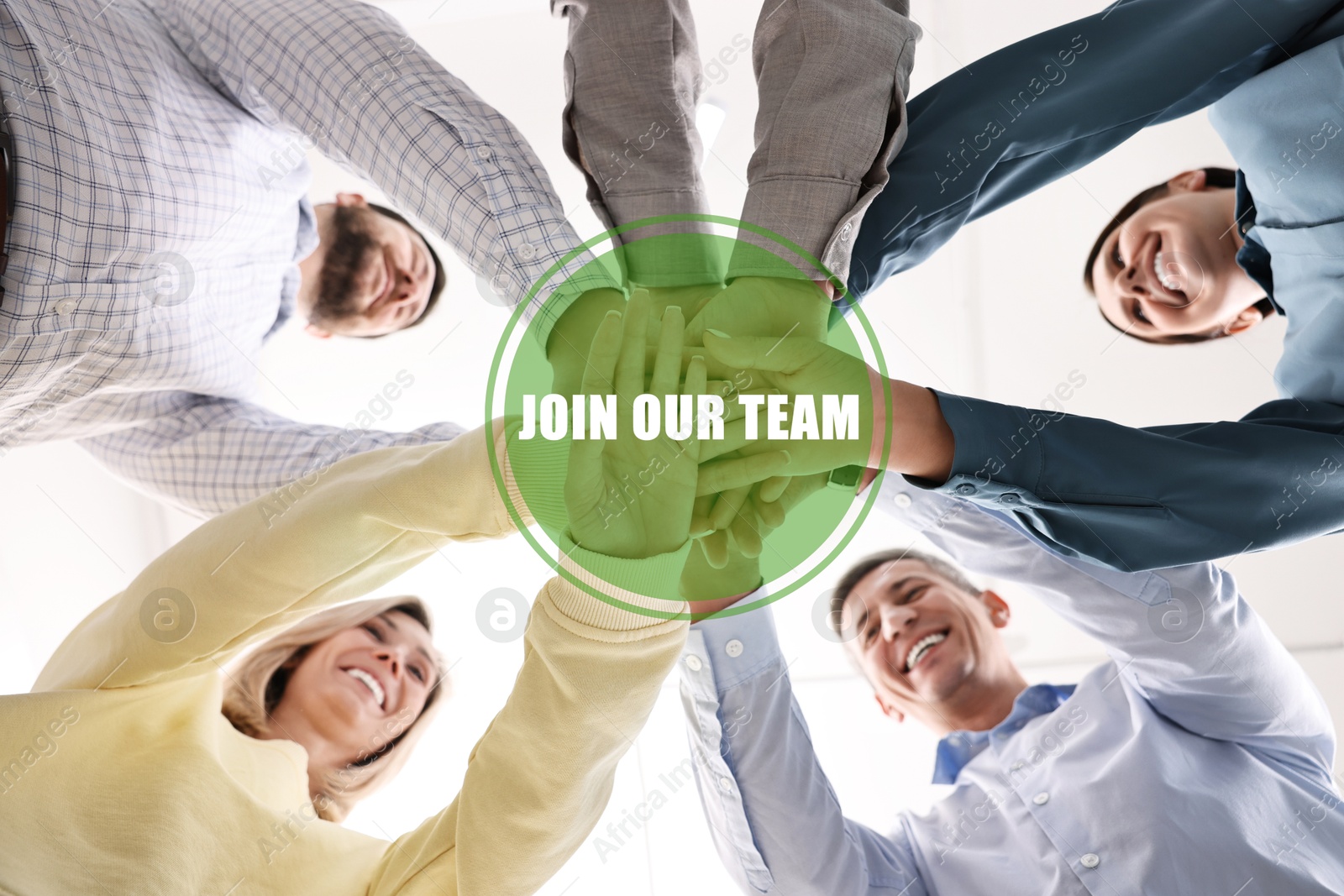 Join Our Team. Group of people holding hands together indoors, bottom view. Employee search, recruitment concept Image of Join Our Team. Group of people holding hands together indoors, bottom view. Employee search, recruitment concept
