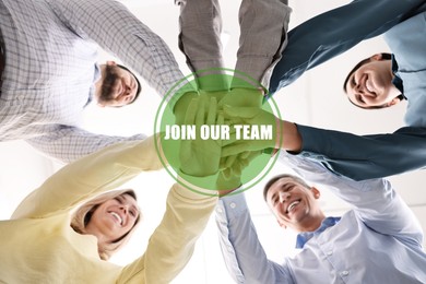 Image of Join Our Team. Group of people holding hands together indoors, bottom view. Employee search, recruitment concept