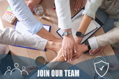 Image of Join Our Team. Group of people holding hands together at table indoors, closeup. Employee search, recruitment concept