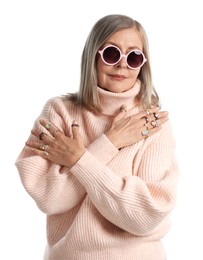 Photo of Senior woman wearing different rings on white background