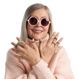 Photo of Senior woman wearing different rings on white background