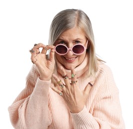 Photo of Senior woman wearing different rings and sunglasses on white background