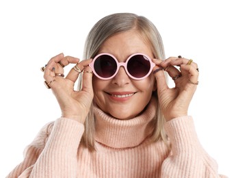 Photo of Senior woman wearing different rings and sunglasses on white background